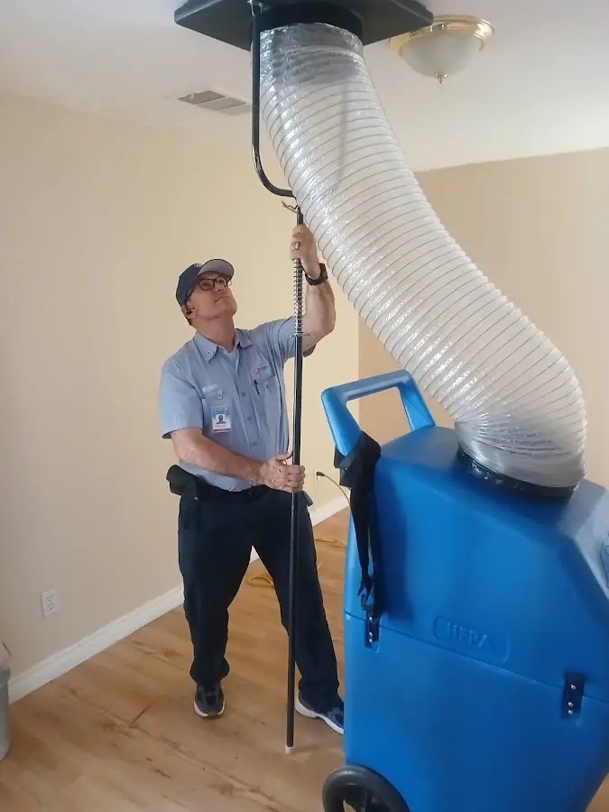 HVAC Installation technician using HEPA equipment in Willis
